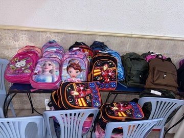 A schoolbag, a smile, a future